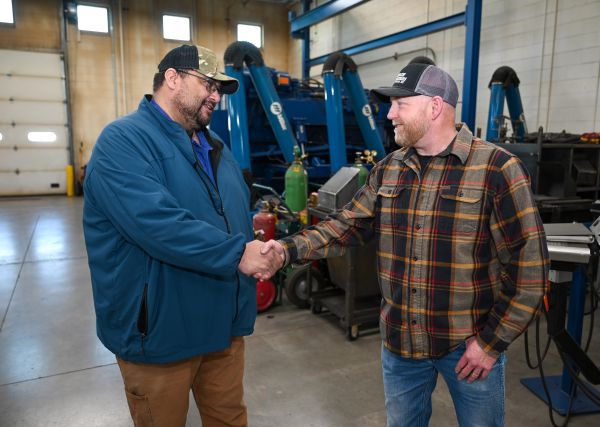 Felix Belmontez and Great Falls College welding instructor Todd Reser discuss the grant Phillips 66 awarded Great Falls College.