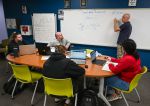 Mark Plante leads a math study session at Great Falls College. Spring enrollment at the college is up almost 10 percent.