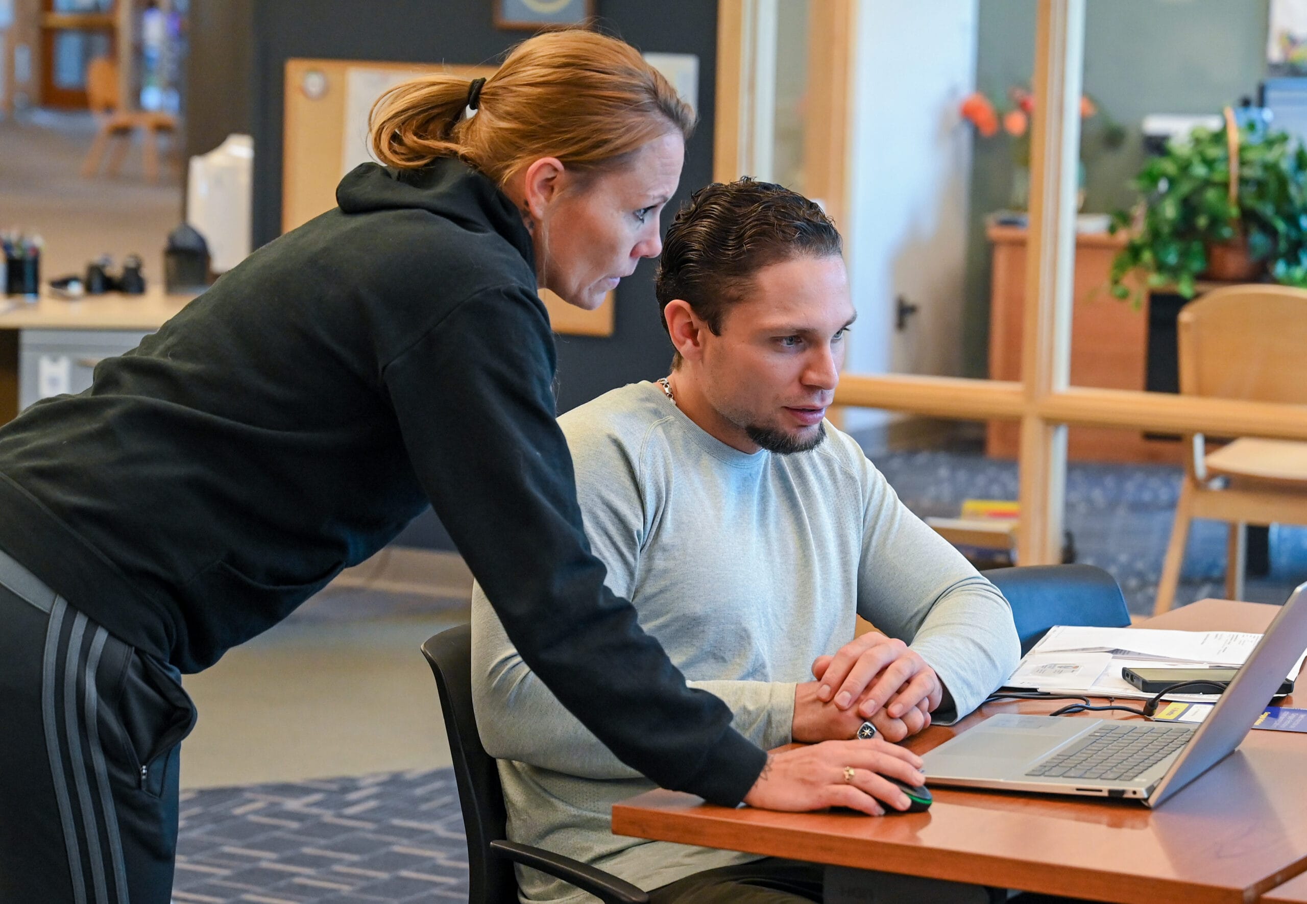 Student receiving tutoring assistance from another student.