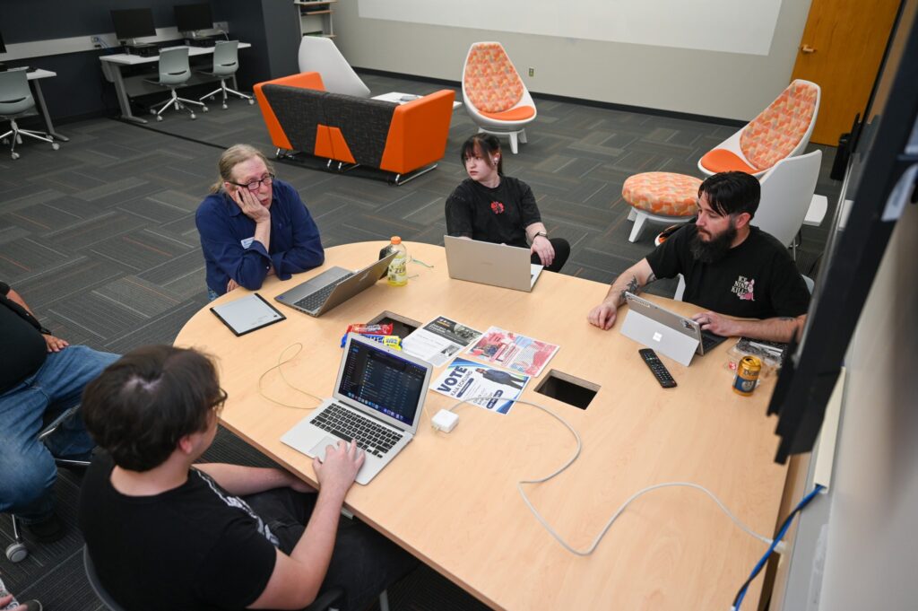 Group of computer programming students in study lounge